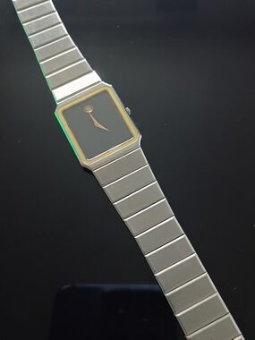 Movado Silver Watch with Black Dial and Gold Trim